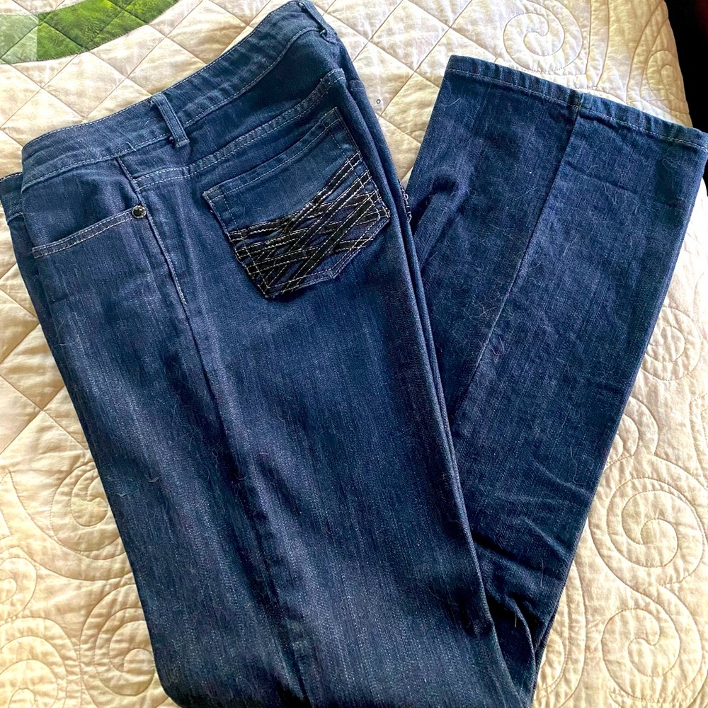 Blue jeans with design on back pockets